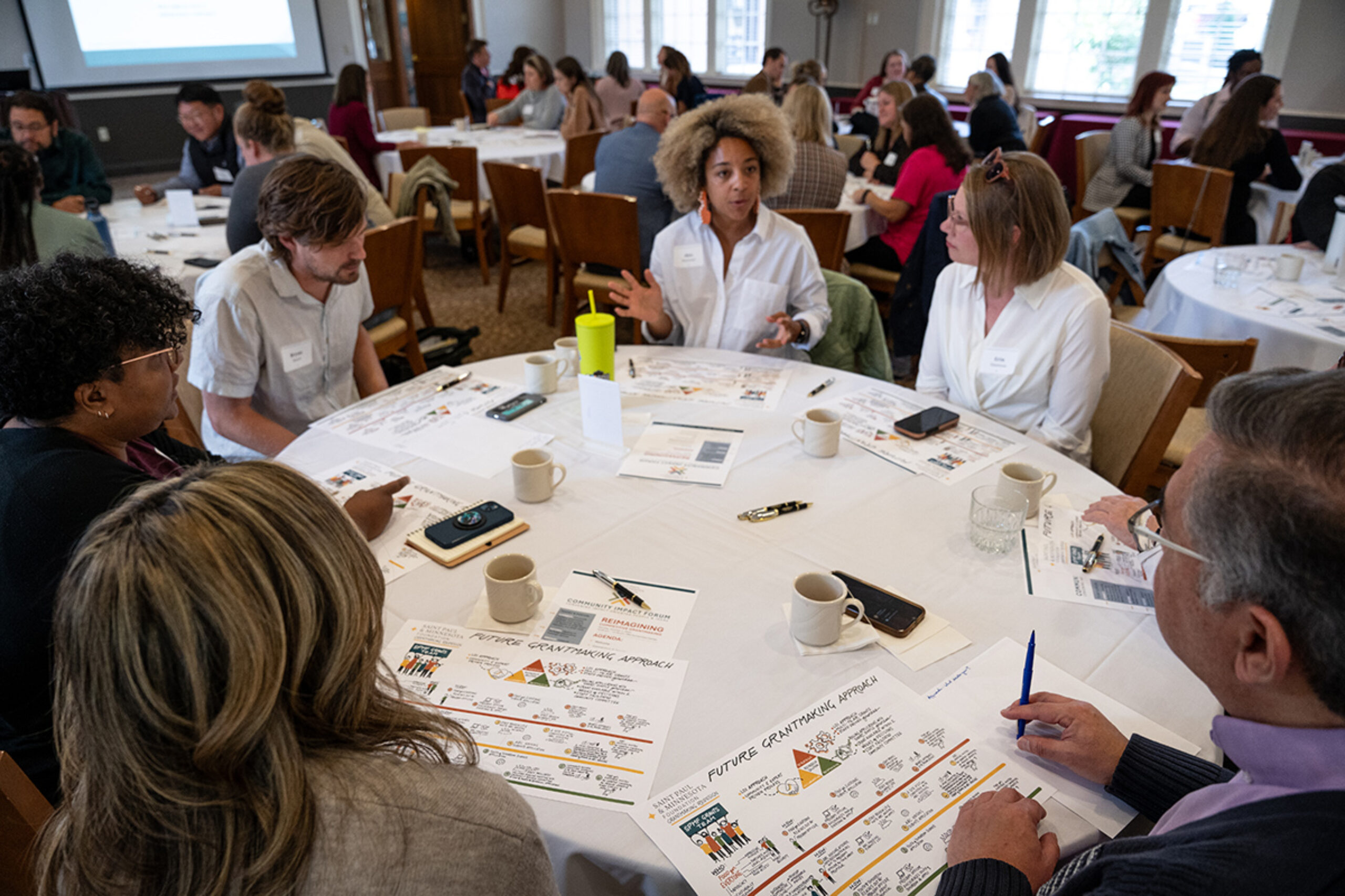 Board member and community members at a grant redesign sessions