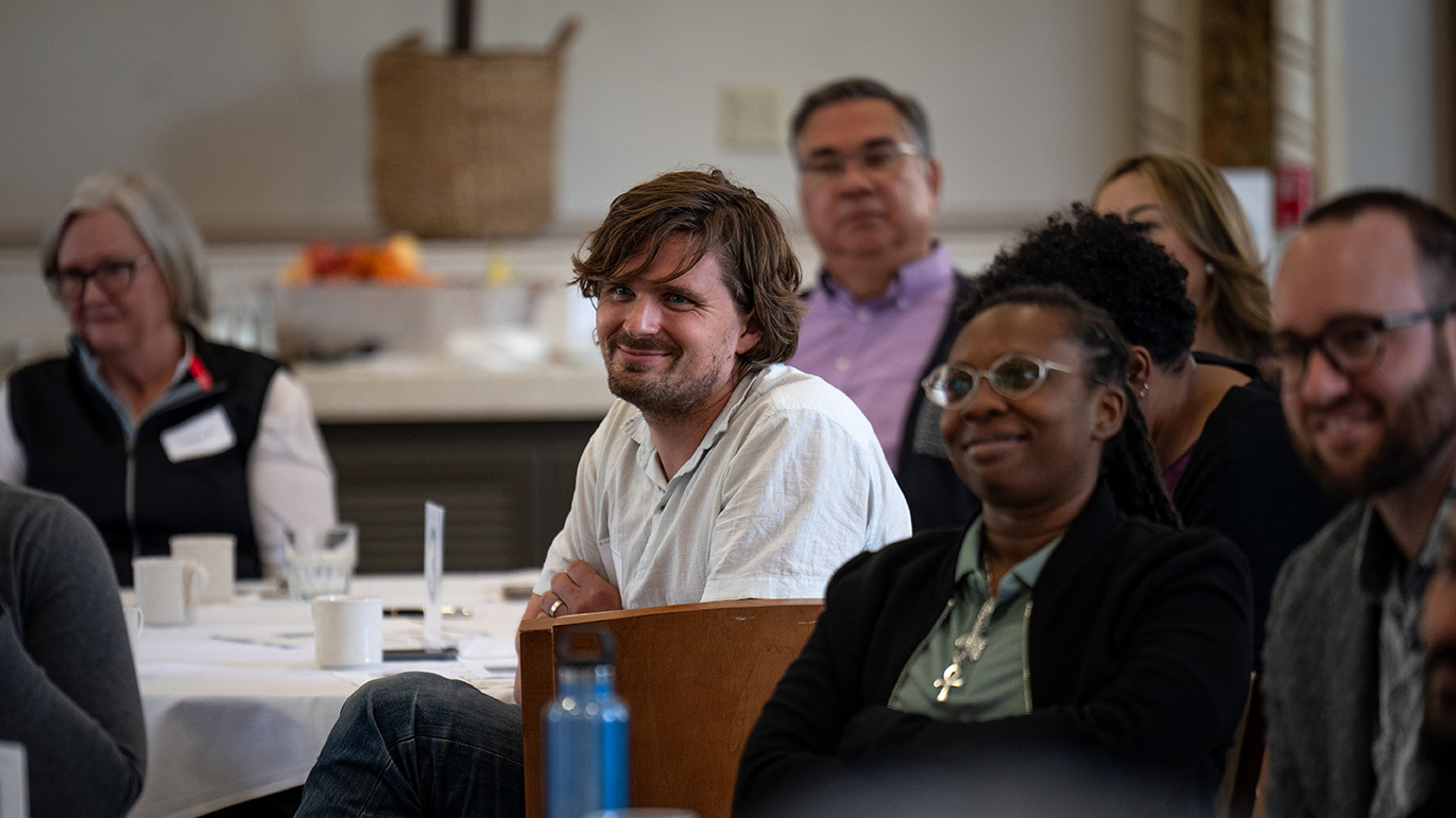 People smiling at an event