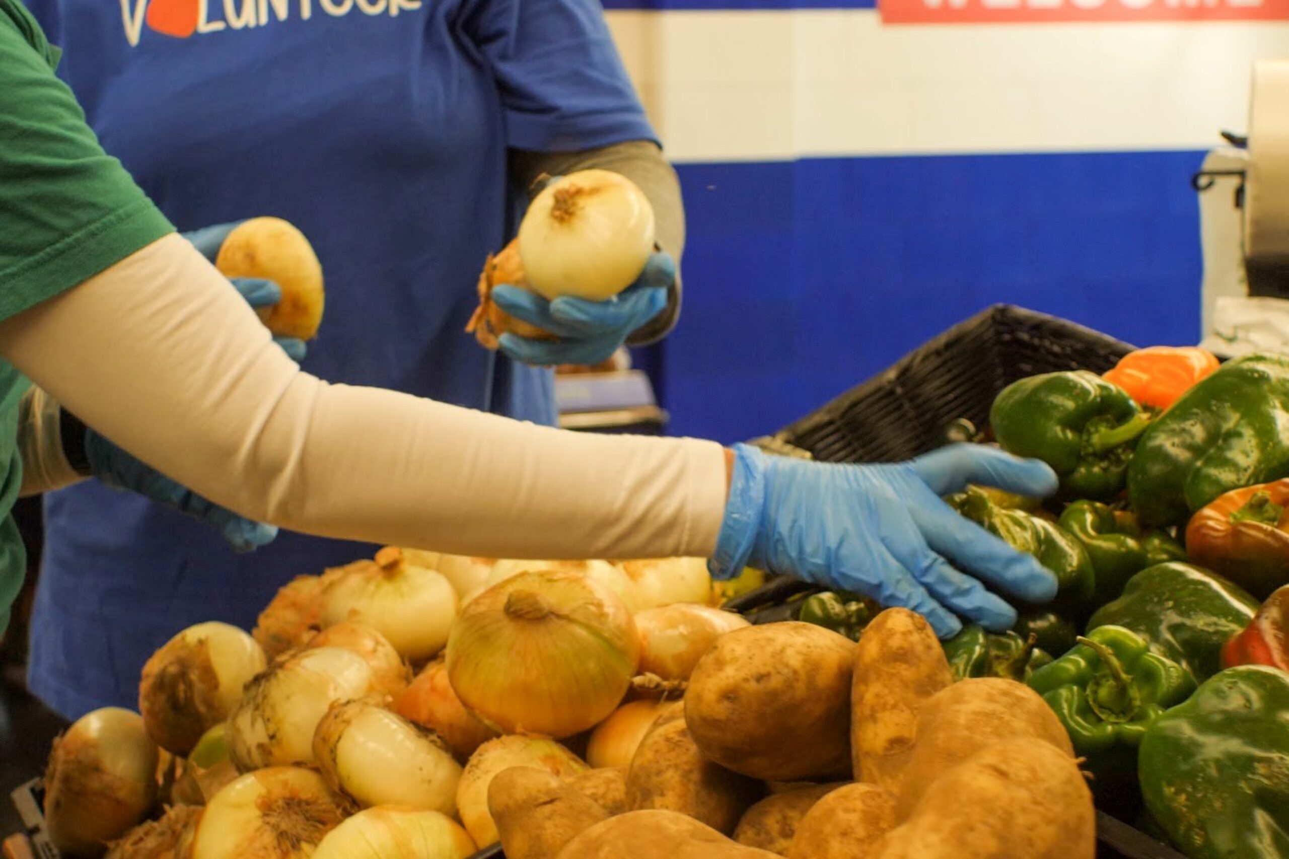 Volunteers stocking a food shelf