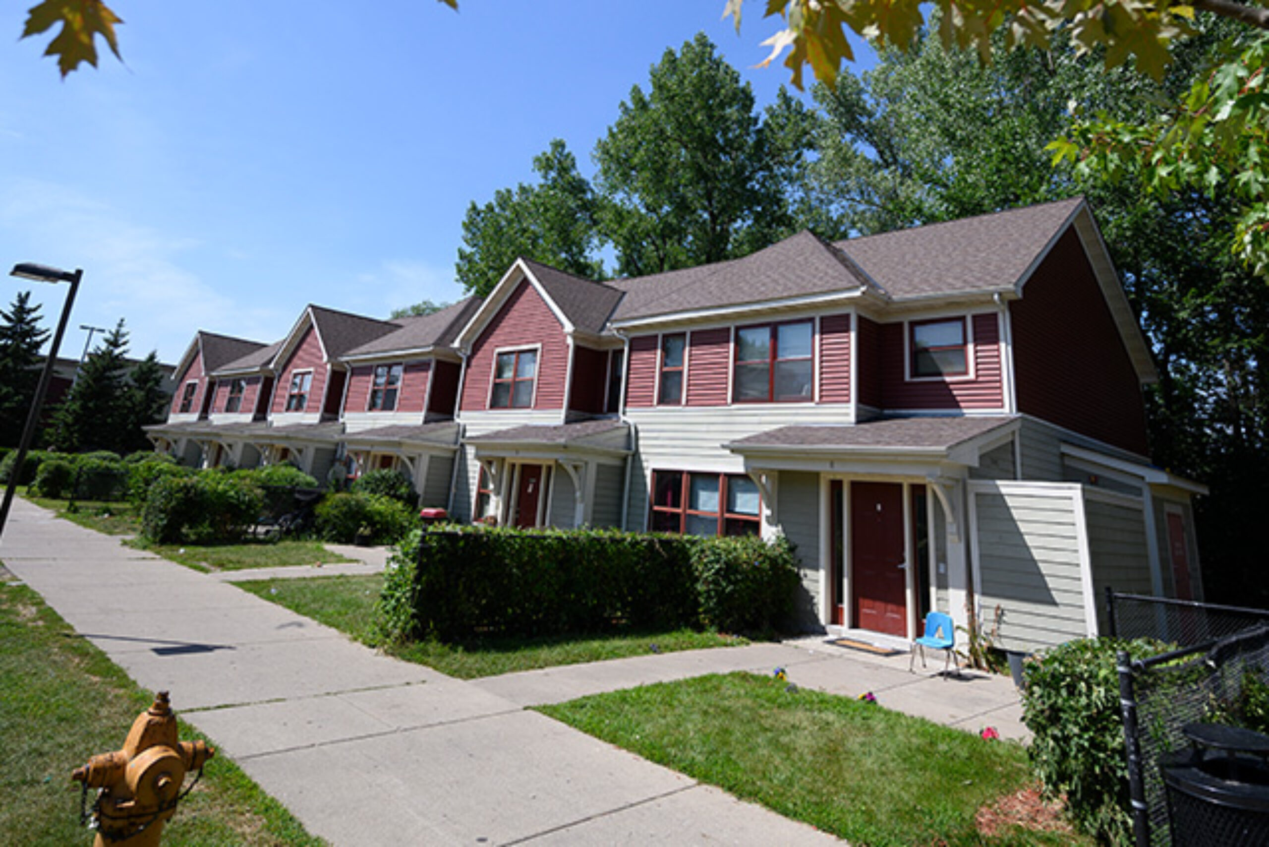 A row of red townhomes
